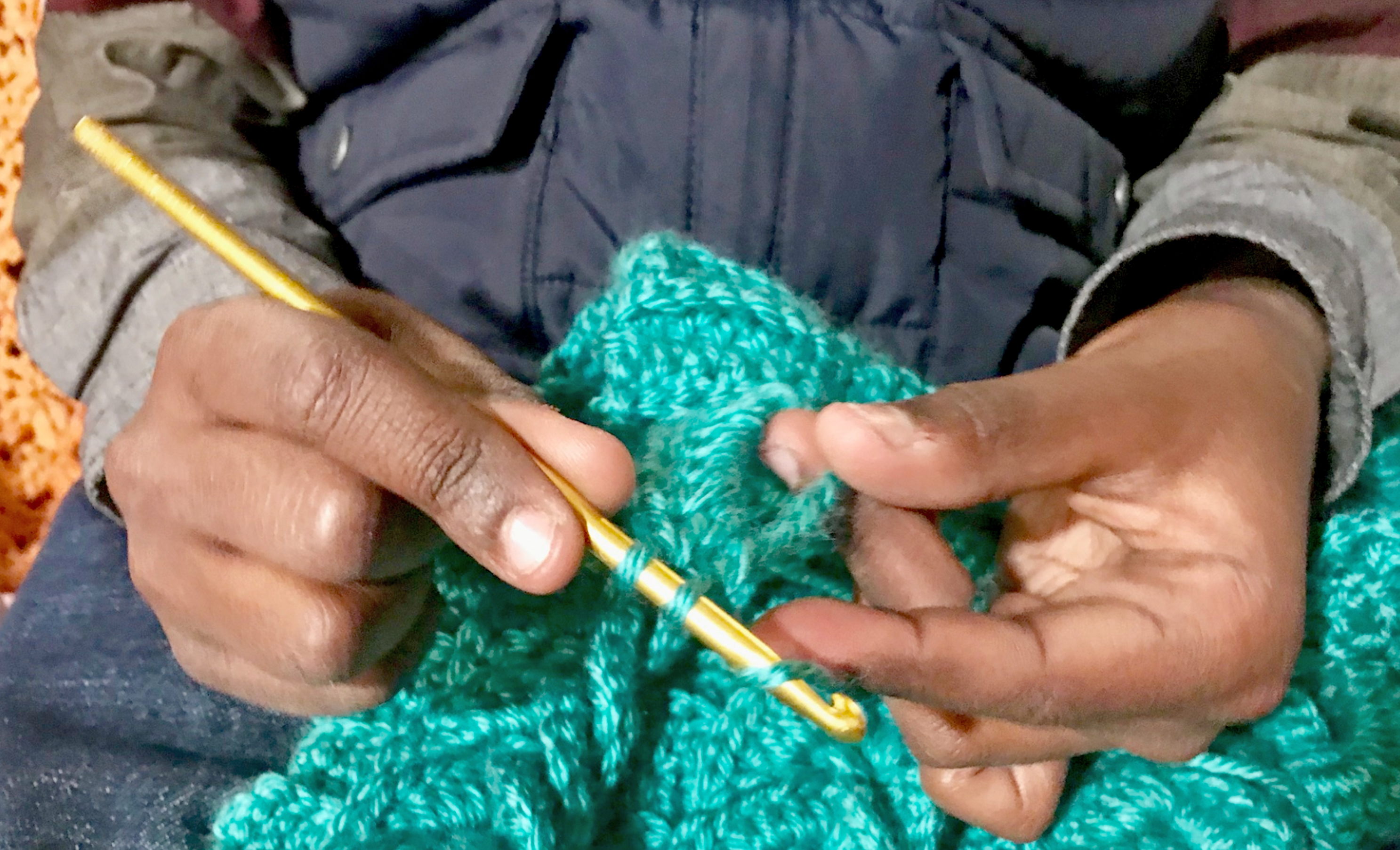 boys hands crocheting