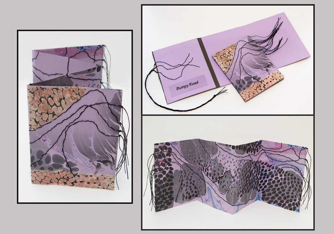 Accordion book by Cristina Hajosy featuring marbling and fibers. 
