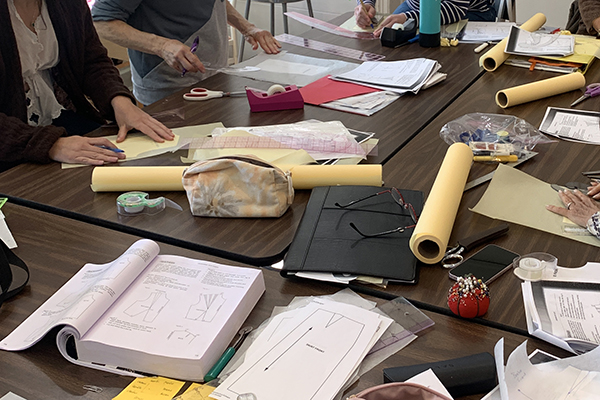 Students working on sewing pattern blocks.