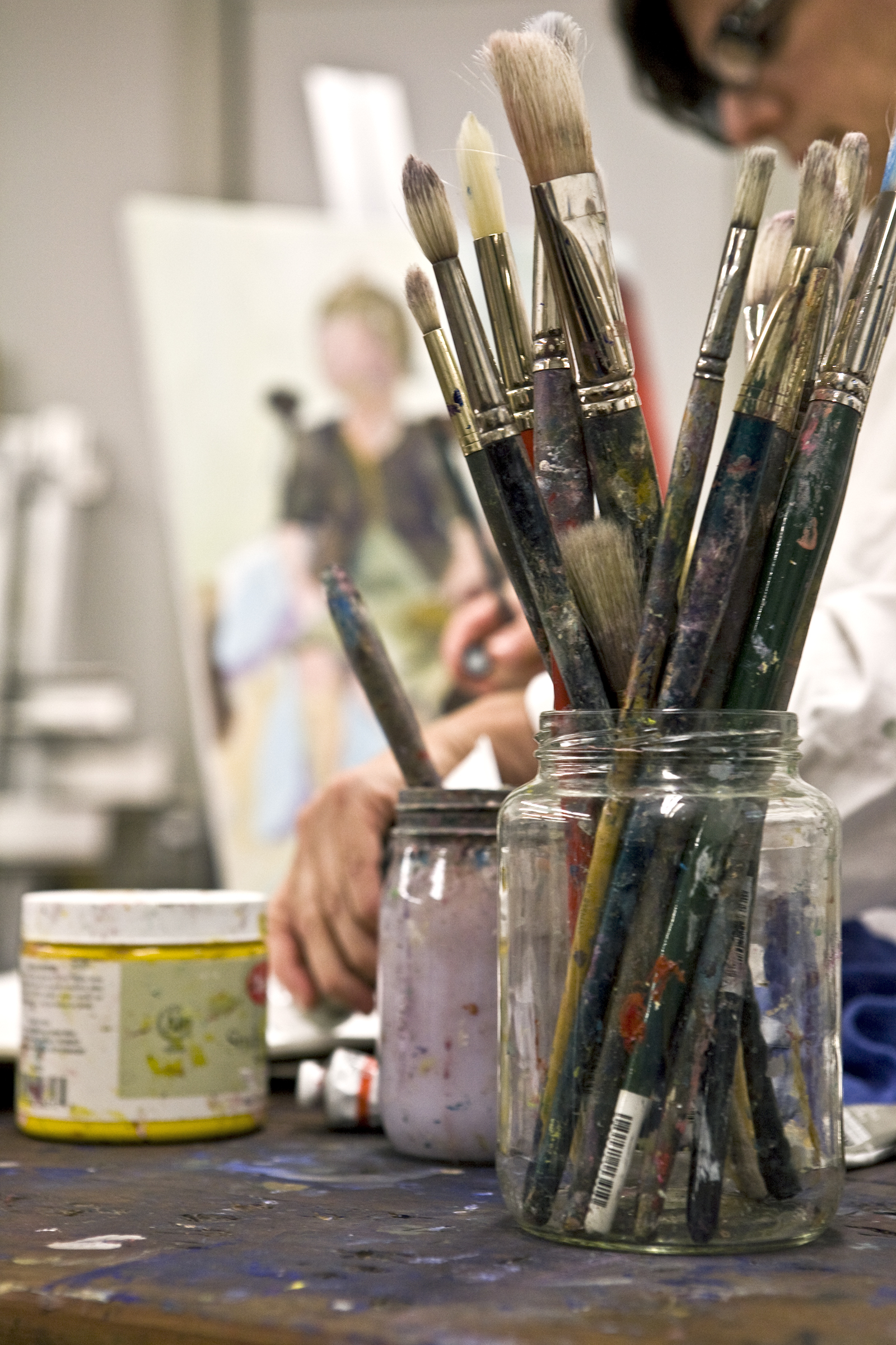 paintbrushes in a jar